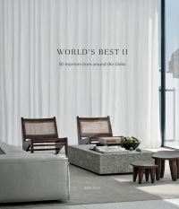 Book cover of World's Best II: 50 Interiors From Around the Globe, featuring a minimalist interior with marble table and long white drapes. Published by Beta-Plus.