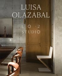 Book cover of Luisa Olazábal: LO·2 Studio, featuring an interior living space with wood table and chairs, and a curved cupboard. Published by Ediciones El Viso.