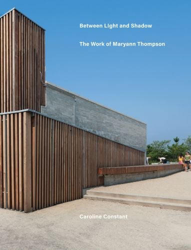 Book cover of Between Light and Shadow: The Work of Maryann Thompson, featuring a building with wood slates to exterior. Published by ORO Editions.