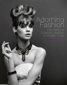 Book cover of Adorning Fashion: The History of Costume Jewellery to Modern Times, featuring Jean Shrimpton modelling large beaded jewelry for ‘Voice & Vision’, John French, 1963. Published by ACC Art Books.