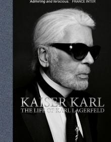 Book cover of Kaiser Karl, the life of Karl Lagerfeld, featuring the fashion designer wearing dark glasses. Published by ACC Art Books.