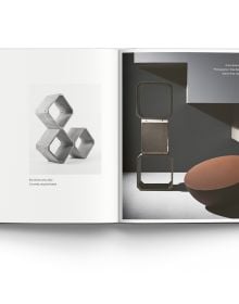 Book cover of Refashioning Concrete, with a gray wall, with products made from concrete below. Published by ACC Art Books.