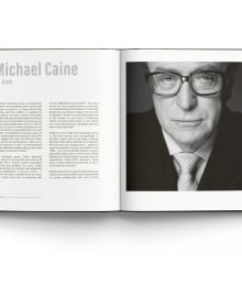 Book cover of 'Michael Caine, Photographed by Terry O'Neill, featuring the actor staring seriously at the camera, from the 1966 film 'Funeral in Berlin'. Published by ACC Art Books.