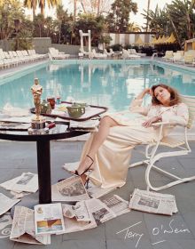 American actress Faye Dunaway takes breakfast by the pool with the day's newspapers at the Beverly Hills Hotel, on cover of 'Terry O’Neill: Every Picture Tells a Story', by ACC Art Books