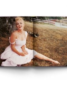 Book cover of Terry Newman's Marilyn Monroe Style, with the American actress smiling at camera. Published by ACC Art Books.