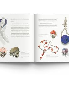 Small diamond encrusted jewelry piece with three larger gemstones, on cover of '21st-Century Jewellery Designers An Inspired Style', by ACC Art Books.