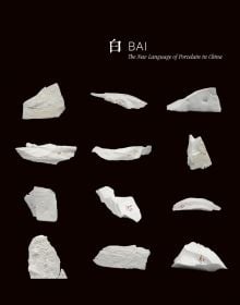 12 white shards of ceramic on black cover of 'Bai: The New Language of Porcelain in China', by ACC Art Books.