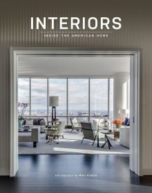 Book cover of Interiors Inside the American Home, feature a bright, open plan interior with pale furniture and large windows looking out onto cityscape, Published by Images Publishing.