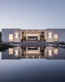 Book cover of Infinity House: An Endless View, with a relaxing view from interior with the blue sky above the sea. Published by Images Publishing.