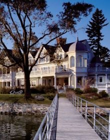 Book cover of Wadia Associates: New Classicists; Residential Architecture of Distinction, with a Queen Anne style home illuminated by dusky pink evening sky. Published by Images Publishing.