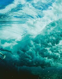 Book cover of Life Around the Sea: Capturing the Heart of Australian Surf Culture, with the waves of the sea, and land behind. Published by Images Publishing.