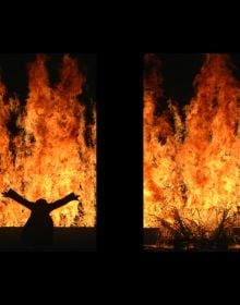 Black woman, eyes closed, floating under water in silk top, Bill Viola Michelangelo Life Death Rebirth in white font to lower half