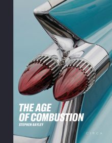 Close up of duel rear lights of blue Cadillac on cover of 'The Age of Combustion, Notes on Automobile Design', by Circa Press.