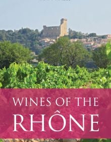 Book cover of Matt Wall's guide, Wines of the Rhône, with vineyards and castle behind. Published by Academie du Vin.