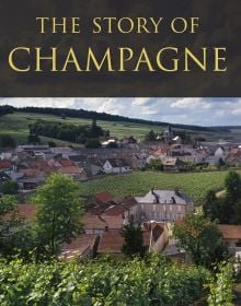 Book cover of Nicholas Faith's guide, The Story of Champagne, with a view a vineyards and roof tops in the distance. Published by Academie du Vin Library.