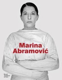 Art catalogue cover of Marina Abramovi?, Dutch Edition, featuring the Serbian artist in a straight-jacket, staring sternly at the viewer. Published by Royal Academy of Arts.