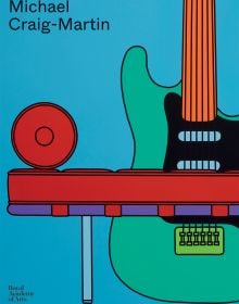 Book cover of Michael Craig-Martin, with a painting of green electric guitar behind red bench seat. Published by Royal Academy of Arts.