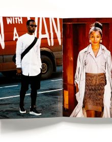 Black skinned woman in peplum top and glasses, high style dreadlocks, Street Culture in white font below