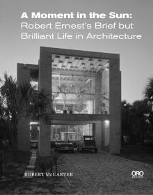 Book cover of A Moment in the Sun: Robert Ernest’s Brief but Brilliant Life in Architecture, with a beach House in Florida; with palm tree to left. Published by ORO Editions.