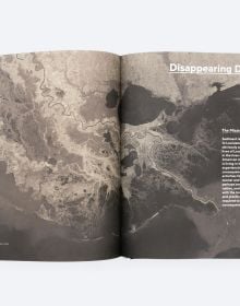 Book cover of The Dredge Research Collaborative's Silt Sand and Slurry: Dredging, Sediment, and the Worlds We Are Making, with aerial view of sandy land with water. Published by ORO Editions.