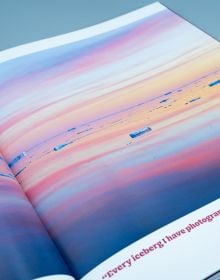 Book cover of Seeing It All, Women Photographers Expose our Planet, with a large iceberg floating on sea, under orange sky. Published by ORO Editions.