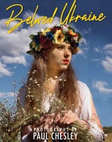 Book cover of Beloved Ukraine, Photographs by Paul Chesley, with a girl with long flowing hair wearing a floral headpiece. Published by ORO Editions.