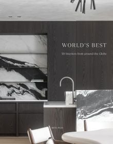 Book cover of World's Best, 50 Interiors from Around the Globe, featuring a kitchen interior of black and white marble features, and black wood, floor to ceiling storage. Published by Beta-Plus.