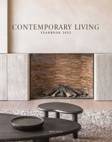 Book cover of Contemporary Living Yearbook 2025, with an interior living room with brick fireplace, pale walls and dark wood furniture. Published by Beta-Plus.