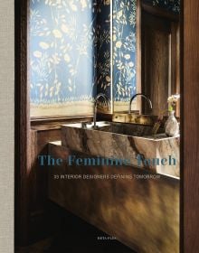 Book cover of The Feminine Touch: 33 Interior Designers Defining Tomorrow, with an interior with a marble sink and floral walls. Published by Beta-Plus.