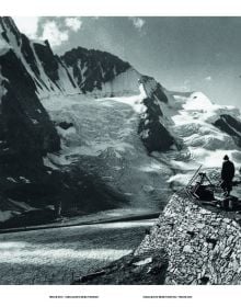 Hairpin bend in road with snow-topped mountains behind, on cover of 'Pass Portrait - Grossglockner, Austria 2504M', by Delius Klasing.