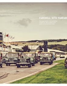 Front of Land Rover with driver, to centre of red heart, on white cover of 'Landy Love, Since 1948', by Delius Klasing.