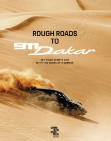 Book cover of Rough Roads to 911 Dakar, featuring a black Porsche 911 racing down a sand dune in the desert. Published by Delius.