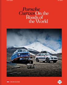 Book cover of Stefan Bogner's Porsche Curves: On the Roads of the World, with a VW transporter with caterpillar tracks and a Porsche Cayenne. Published by Delius Klasing Verlag GmbH.