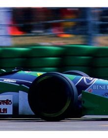 Book cover of World Championship Cars: Michael Schumacher, with side profile of the front end of a F1 red Ferrari. Published by Delius Klasing.