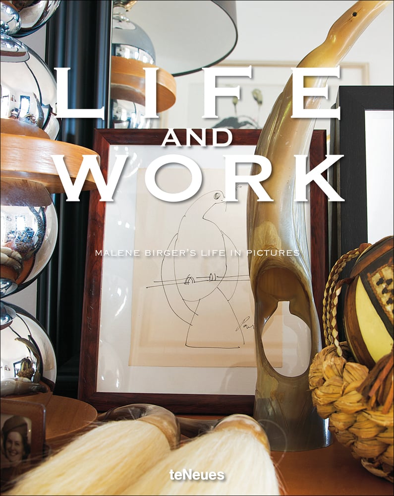 Dressing table with mirror, framed picture and carved sculpture, LIFE AND WORK, in white font above.