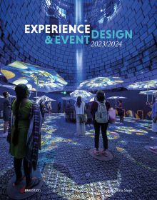 Exhibition space with people looking up at blue lights and umbrellas, on cover of 'Experience & Event Design 2023 / 2024', by Avedition.
