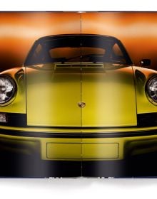 Book cover of René Staud's The Porsche 911 Book, New Revised Edition, featuring a red Porsche 911 model. Published by teNeues Books.