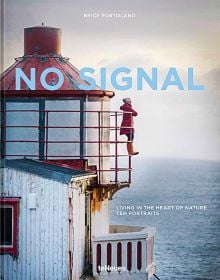 Book cover of No Signal: Living in the Heart of Nature. Ten Portraits, featuring a person standing on the metal barrier of a lighthouse building, looking out to sea. Published by teNeues Books.