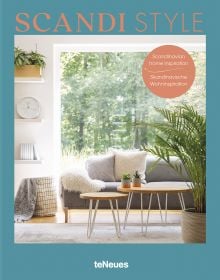 Book cover of Scandi Style, Scandinavian Home Inspiration, with a calm interior with white and grey furnishings, coffee-table, and forest outside. Published by teNeues.