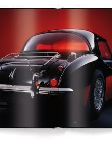 Book cover of Black Beauties, Iconic Cars with a black Bugatti Veyron Grand Sport Vitesse with illuminated lights. Published by teNeues Books.