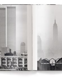 Man wearing white sailor's clothes and hat, with his back to viewer, staring across busy city street, on cover of 'Elliott Erwitt’s New York', by teNeues Books.