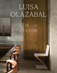 Book cover of Luisa Olazábal: LO·2 Studio, featuring an interior living space with wood table and chairs, and a curved cupboard. Published by Ediciones El Viso.