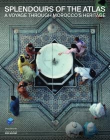 Book cover of Splendours of the Atlas: A Voyage Through Morocco’s Heritage, with an aerial view of fountain surrounded by a decorative mosaic floor. Published by Silvana.