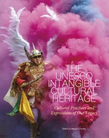 Carnival of Oruro with man dancing through pink smoke, on cover of 'The UNESCO Intangible Cultural Heritage, Cultural Practices and Expressions of our Legacy', by White Star.