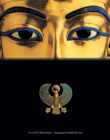 Book cover of Tutankhamun, with a close-up of the eyes of the golden statue of the Egyptian Pharaoh; Falcon Pectoral below. Published by White Star.