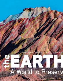 Book cover of The Earth, A World to Preserve, with Zhangye National Geopark, China, with rainbow-coloured surface. Published by White Star.