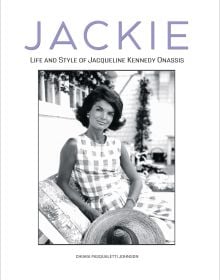 Book cover of Jackie, Life and Style of Jaqueline Kennedy Onassis, with the Former First Lady of the United State wearing a checked dress, sitting on cushioned recliner. Published by White Star.