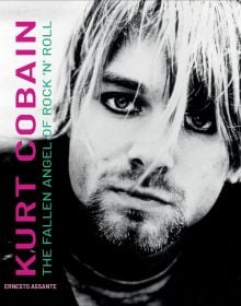 Book cover of Kurt Cobain: The Fallen Angel of Rock 'N' Roll, with an iconic image of the singer wearing thick, black eyeliner, staring into the camera. Published by White Star.