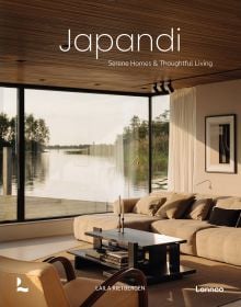 Book cover of Japandi: Serene Homes and Thoughtful Living, with a calming, natural colour living interior with soft sofas and a view through large windows of a lake. Published by Lannoo Publishers.