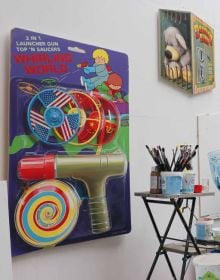 3D cover: red emergency fire alarm box filled with childhood toys, on cover of 'In Case of Lost Childhood, Leon Keer 3D Artworks', by Lannoo Publishers.